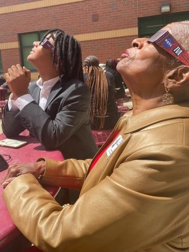 Mimi and Malon watching the solar eclipse